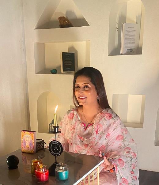 Richa, the Vibrating Crystals astrologer, at her reading table